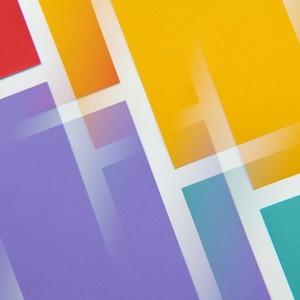 Dynamic and colorful abstract geometric pattern with overlapping shapes and vibrant hues.